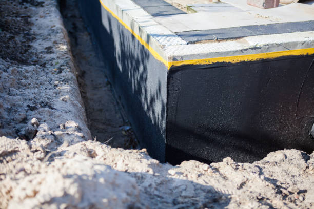 Professional Exterior Waterproofing technician working in Whitehall, MI